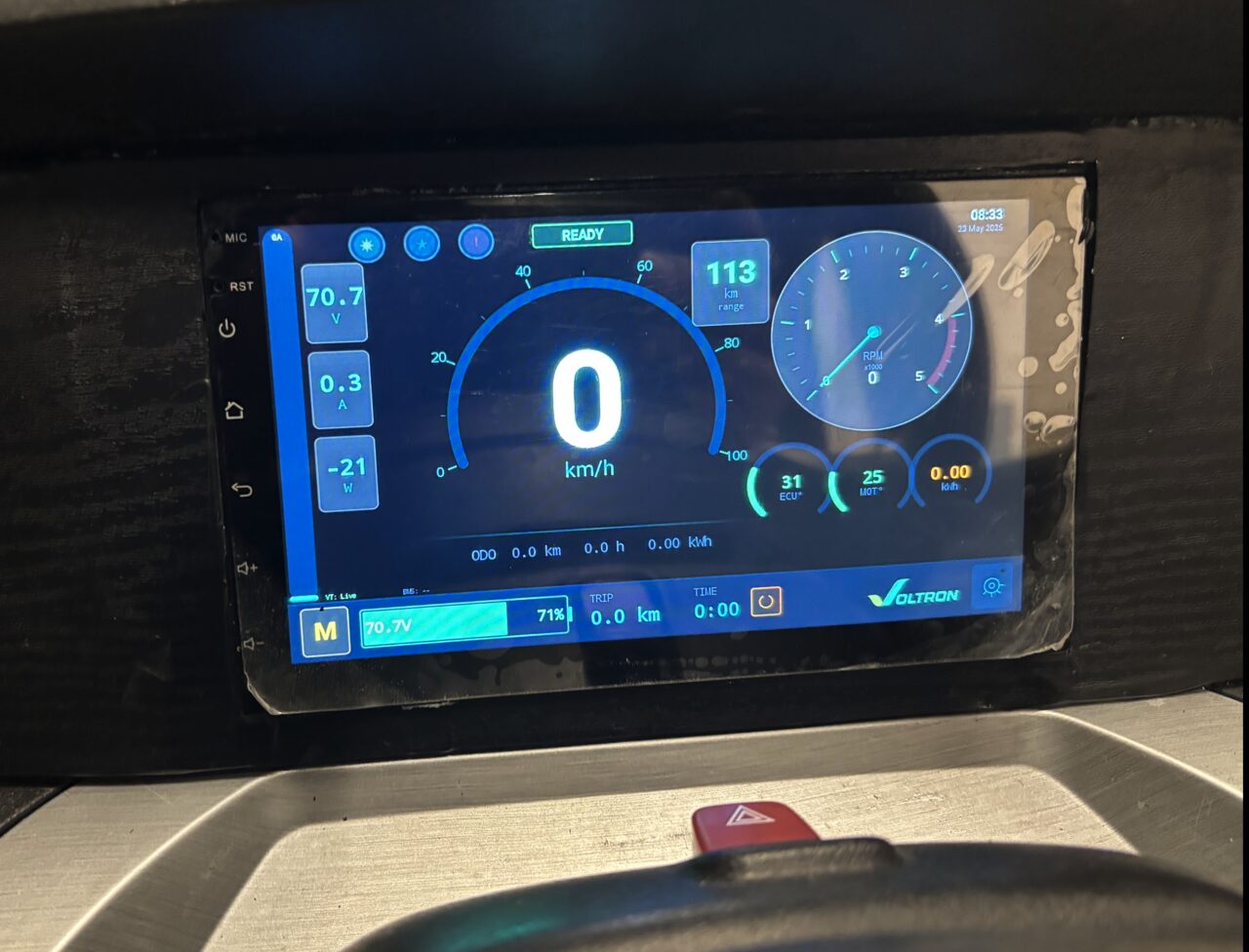 Voltron App running on a real in-vehicle tablet — speedometer, battery readings, mode indicator and live status.