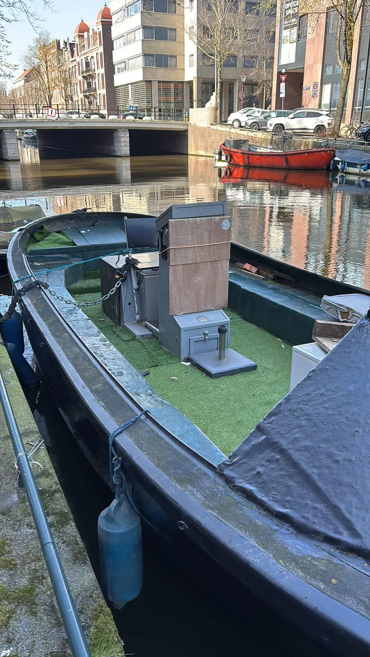 Sister sloop already moored on the canal — cockpit view