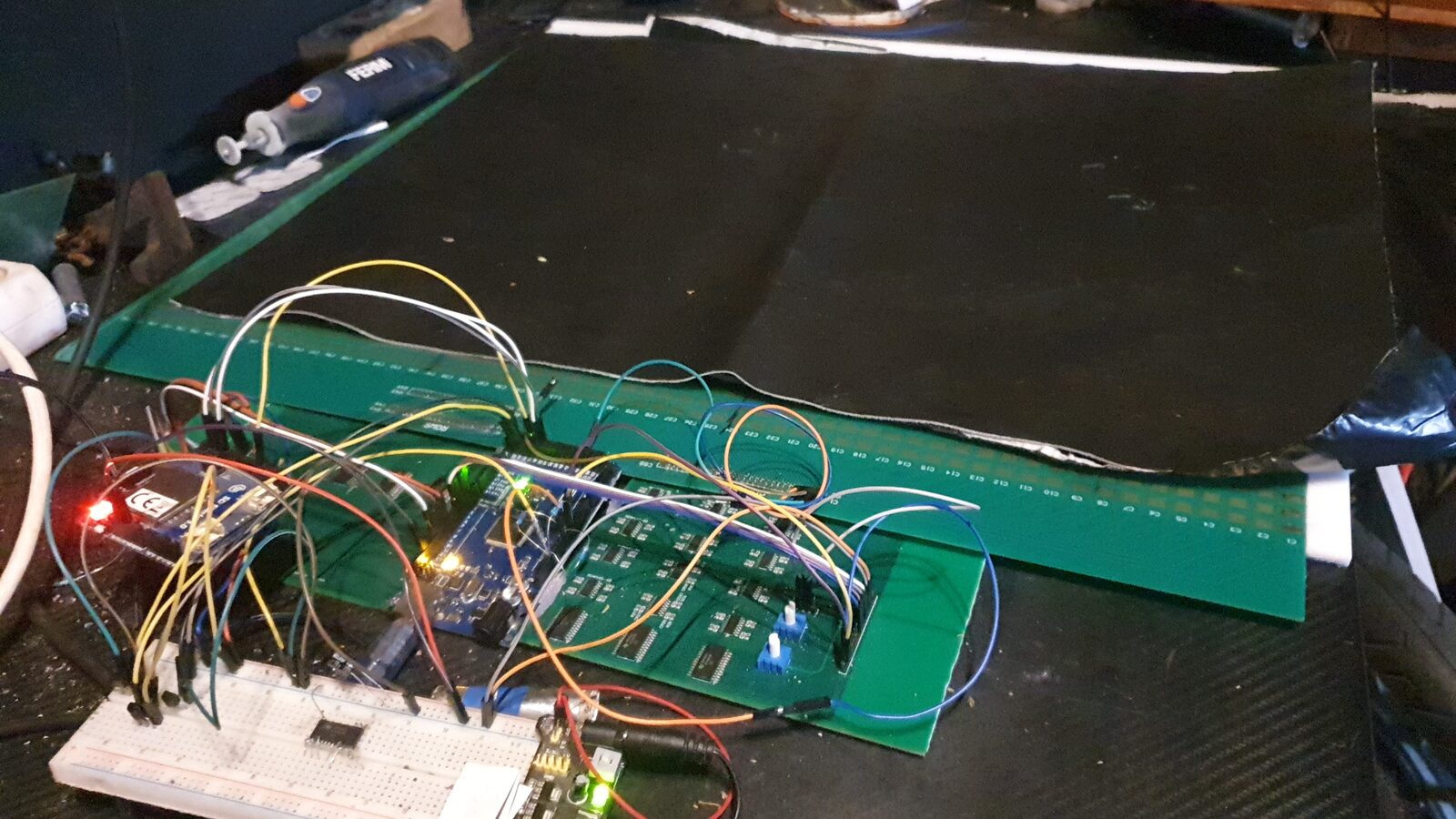 Early Pelmatographos prototype — Arduino driver board, bench rig, sensor sheet