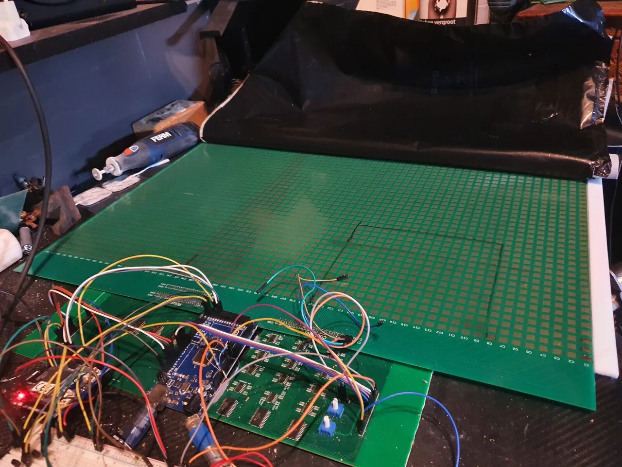 Full-size foot-scanner sensor sheet on the bench with wiring harness