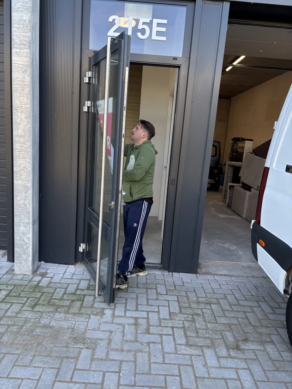 First day inside the new workshop — 215-E, sectional door open